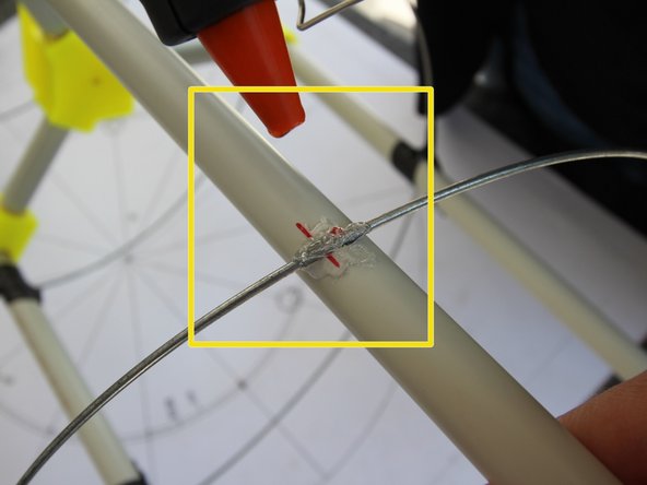 Start removing the black tape that holds the wire on the pipes.