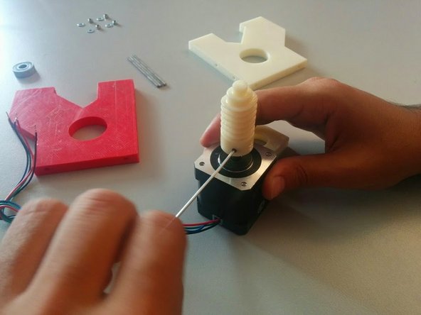 Start by inserting the Worm Gear in the Stepper Motor shaft. Insert the M3 headless screw and bolt it all the way through.