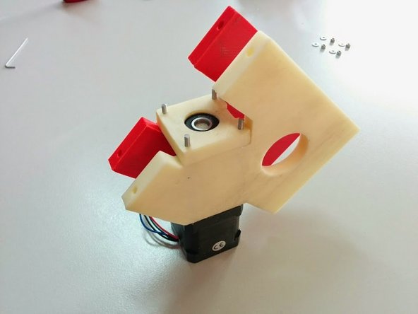 Install the Axis Sides on the threaded rods, and place the Bearing Holder cap on top of them as shown, making sure that the notch is facing as shown.