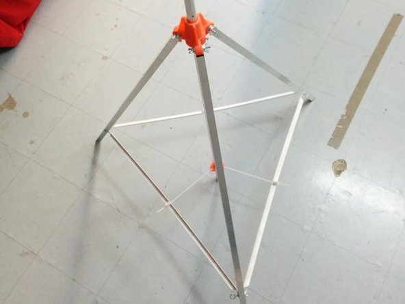 Once all 3 ties are in place, slide the Φ22 aluminum pipe through the top and the bottom 3D printed brackets.