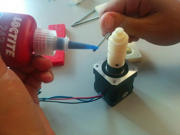 Apply Thread Glue to one side of each threaded rod and screw them on all 4 sides of the Stepper Motor