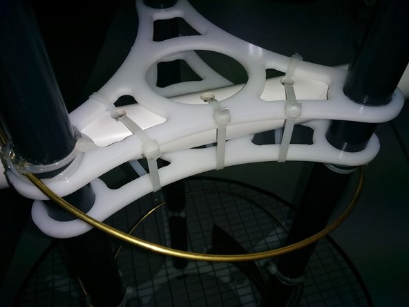 The final positioning is done on the plastic PVC pipe that has holes to tire up two plexiglass stabilizers.