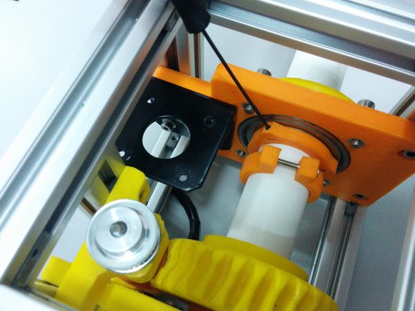 Tighten the alen bolts on the axis spacer collar part.