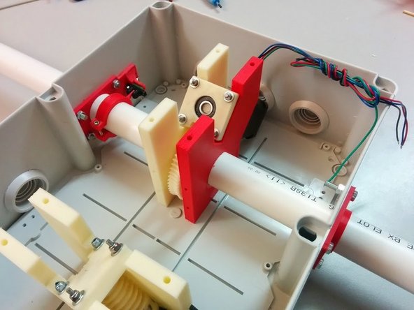Make sure to slide the Axis Tube inside the Homing Ring and then the Homing Sensor Holder before it exits the box. Then align the tube so you can put the M3x50mm bolt that holds the Axis Gear to the Axis Tube.
