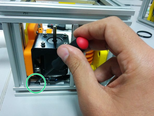 Loose the screws on the hidden corners in a way that stepper motor can slide towards the worm gear.