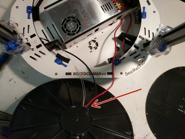 To prepare the heated bed, you must first run the 12awg black and red &amp; (2) 26awg white wires through the bottom side (ribbed side) of the insulator. The hole for wiring is near the center of the bed.