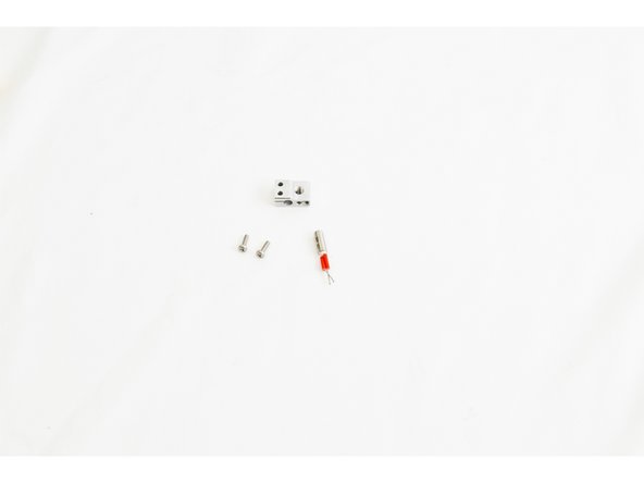 Locate the Heater Block (71216), 12v 40 watt Heater Cartridge (26789), and (2) M3 -.5 x 10mm Phillips Pan Head Machine Screws (30318)