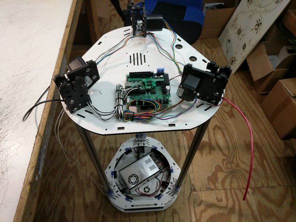 Next we will be installing the top assembly on the printer. It is most helpful if you can get assistance from someone, but this can be completed by yourself.