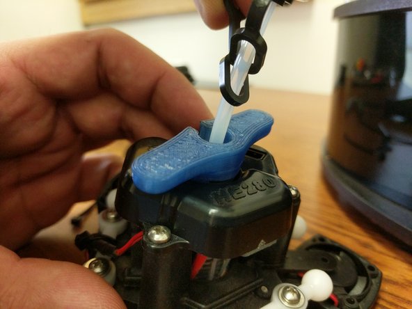 Loosen the PTC adapter in the top of the hot end EXACTLY 2 rotations. (This is the aluminum part on the top of the hot end that has two wrench flats.) You can get this loosened with a pair of need-nose pliers if you do not have a printed PTC tool