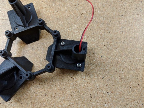 Using 2 of the supplied #4, 1/4&quot; screws  (the short ones from the kit) attach the fan to the platform.  DO NOT over tighten these as they can strip out the fan.  Only tighten them snug.