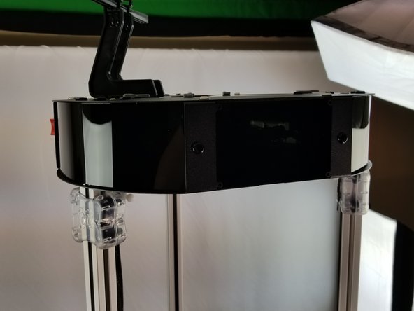 You should also have all 3 acrylic covers over the corners of the upper frame as well.