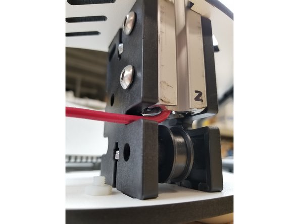 Insert the extrusion into the base top plate, and then through each set of the TSLOT hardware. You will need to have the TSLOT nuts in a vertical orientation to be accepted by the extrusion. You also may need to loosen the TSLOT nuts if you have them too tight.