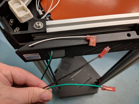 Locate the black and green wires with crimped connectors exiting the Z tower shown. Also locate the short white wire with crimped connector from your Z tower wire pack.