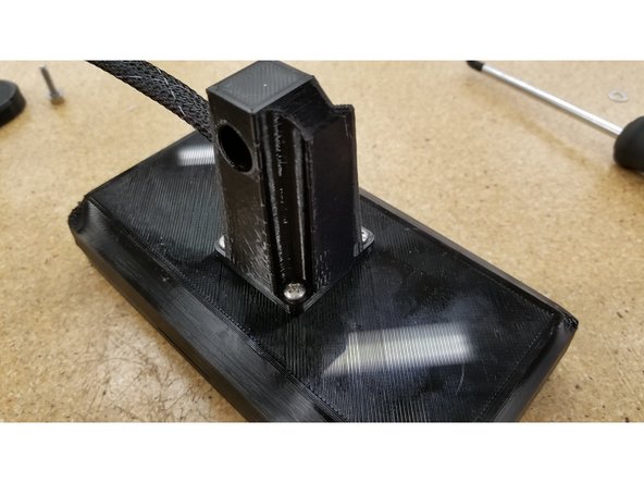 Secure the post in place using the four #6 1/2" L sheet metal screws