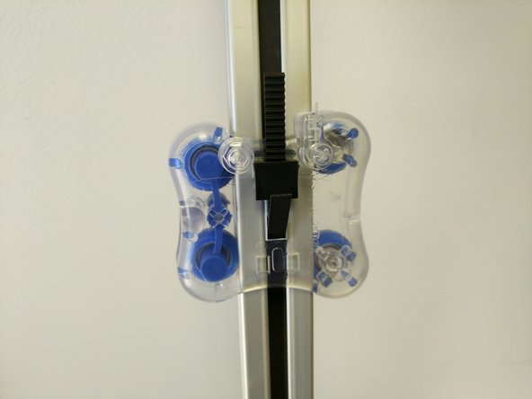 Feed the belt up and between the carriage and TSLOT (at the bottom of the carriage) and through the rectangular opening in the center of the carriage.