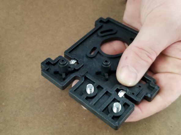 On the larger bracket, install the T-Nuts and hex key bolts on both locations as you did in the previous step.