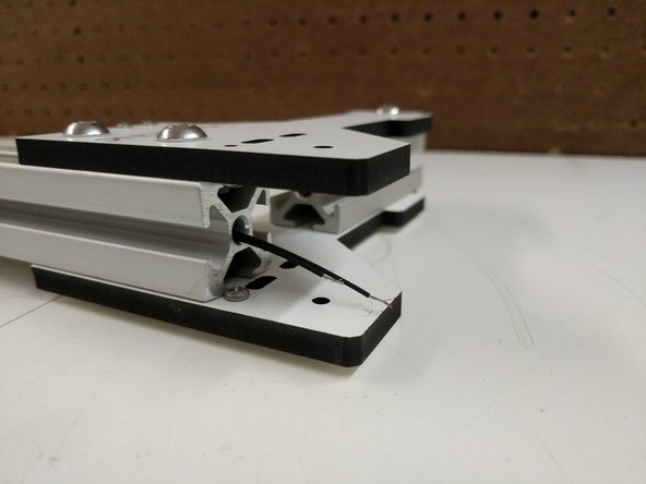 Run 2 wires through each of the towers center as shown. The ends of the wires without connectors should be in the top of the tower assembly.