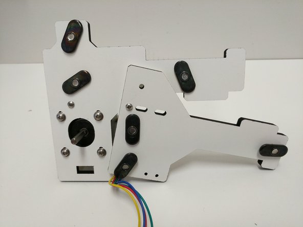 In this step and all other steps using the TSLOT nuts, the boss (ridge) on the nut should be facing away from the head of the button head screw.