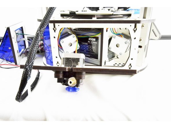 You may find it easiest to remove the PTC fitting from the extruder first and then remove the bowden tube from the fitting as shown in the pictures. If you choose to do it this way, be sure to replace the PTC fitting so it does not get lost.