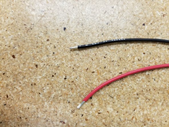 Make sure an adequate amount of the PVC has been stripped from the red and black 20awg wire, and insert into the 2 pin push-in wire terminal as shown.