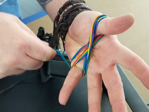 This step we will bundle up the motor wires to reduce the slack on them.