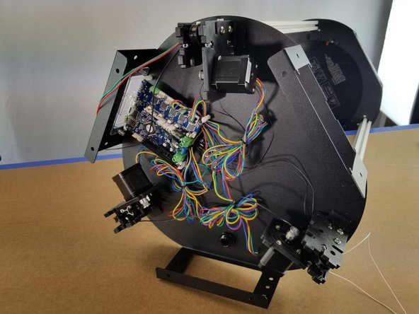 Slide the upper frame on the brackets for all 3 motor mounts so the upper frame is all the way down on all towers.