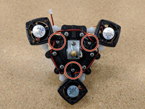 Take special care not to trap a fan lead under a screw head!