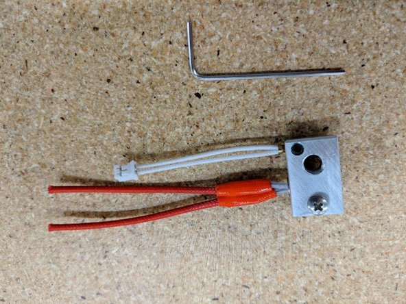 Insert the brass thermistor cartridge into the heater block  as far as it will go.  You may have to use the allen key provided to loosen or remove the set screw in order to insert the thermistor fully.