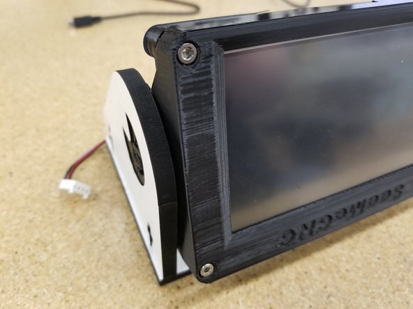 Rotate the side panels inward and press both halves together around the printed enclosure.