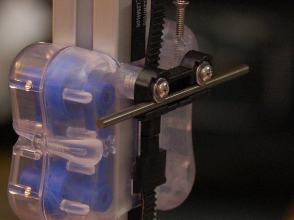 Fit a 3&quot; axle into the axle groove in the mount.  Ensure that it's centered on the carriage.