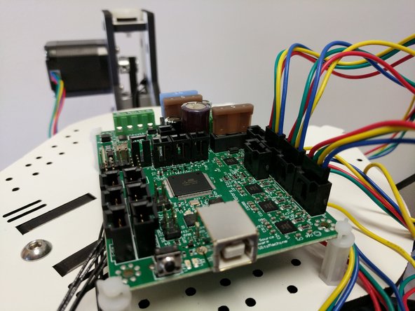 Insert the stepper motor plugs into the Mini-RAMBo. Be sure to put the correct stepper motor in the correct port. and the red wires is on the side of the port closest to the fuses.