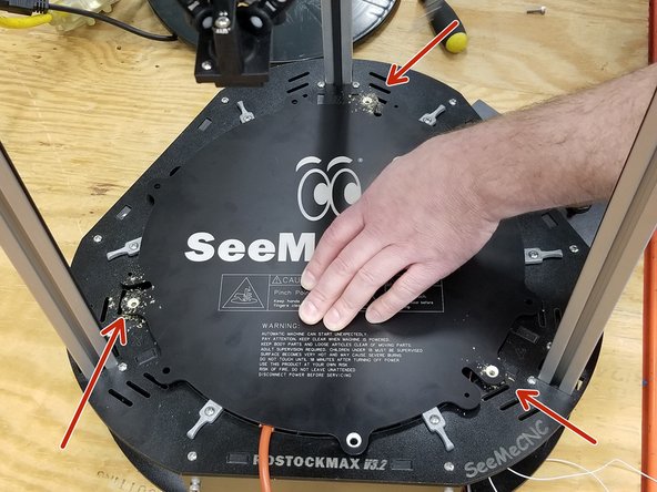 Make sure the heat spreader is lined up with the hole where the bed glass previously sat as perfectly as possible before continuing!