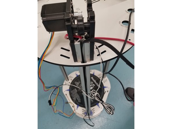 Once you have the belt removed from the carriage you can pull the belt from the top until it clears the timing pulley and idler bearings. Now you can let it hang off the back side of the rail for later use.(see 3rd picture)