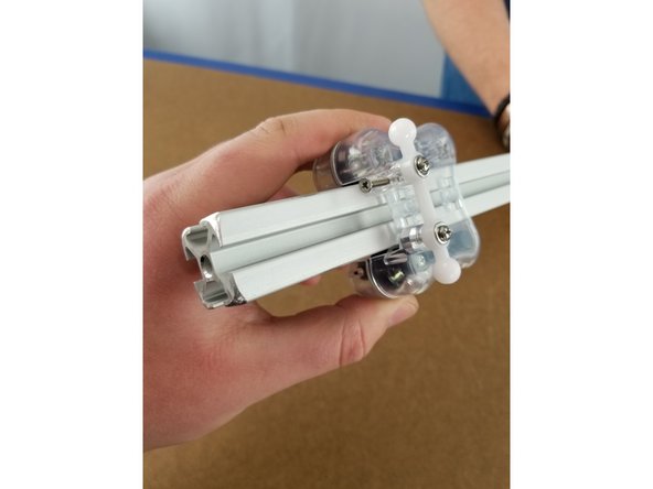 Slide the carriage over the aluminum extrusion with the ball joints on the top and facing the inside of the machine as shown in the pics.