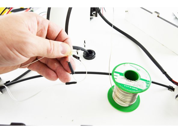 Slide another piece of 15mm long heat-shrink tubing over one of the wires from the second pair of thermistor leads.