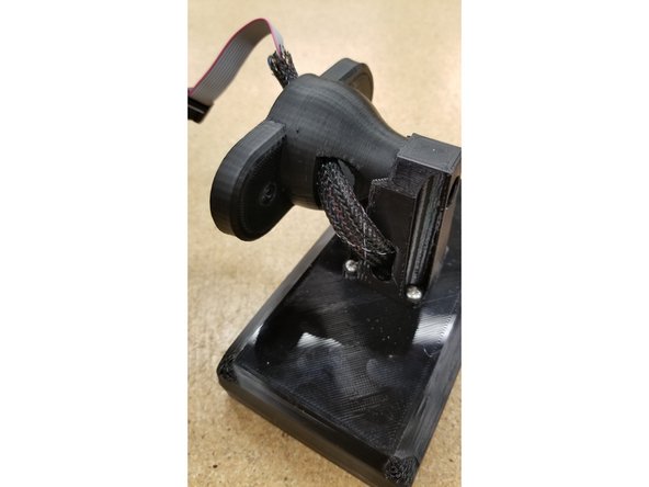 Pass the cables through the screen arm assembly as shown.