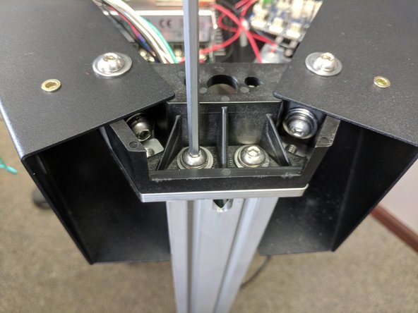 Attach the tower to the upper assembly using 2 each of the provided 1/4-20 x 1" long button head screws, split ring washer, and flat washer. Fully Tighten.