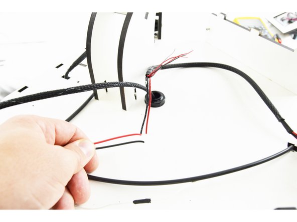 Locate the 18awg wires from the existing wiring (in most instances these wires are red and black) and the new hotend whip.