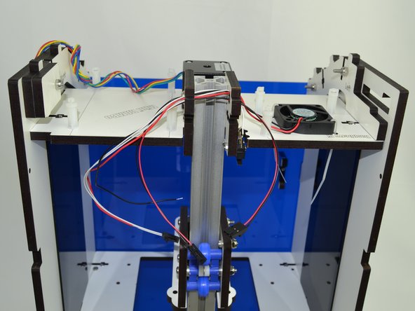 Route the 5v Wire Harness through the same holes. The three pin connector needs to be on the side closest to the fan.