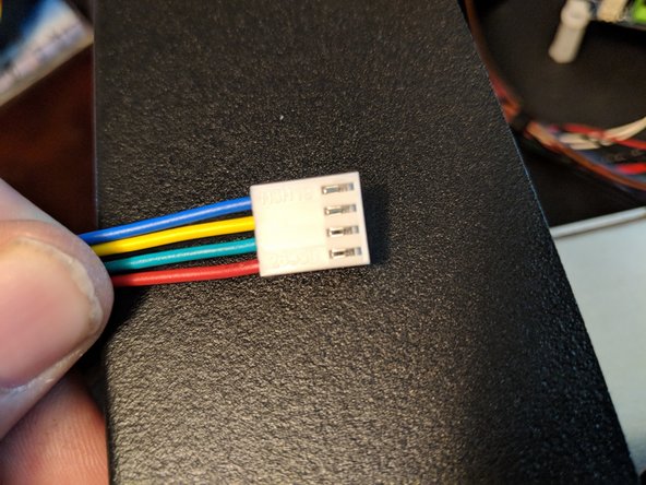 In the top of the machine take the 4 wires from the new extruder motor and insert the wires into the connector.