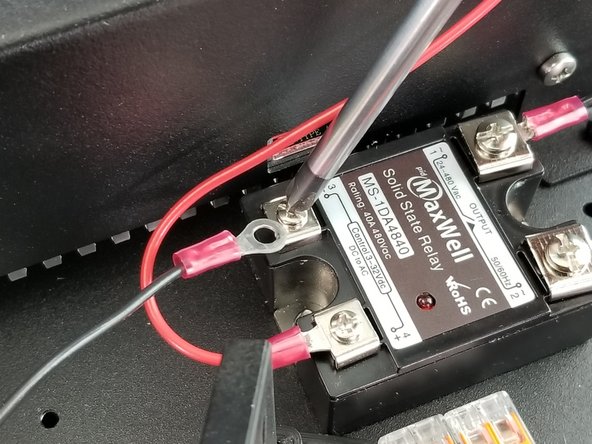 Attach the ring terminal to the solid state  relay in the remaining location next to the power supply as shown in Pic 2.