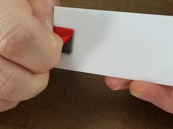 Remove the protective paper from the acrylic and remove the red protective film from the double sided tape as shown in Pic 2 and 3.