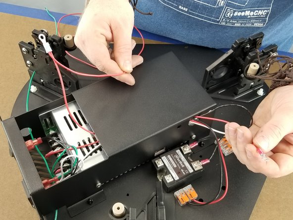 Feed the 400mm long wire over the power supply and through the power supply bracket hole as shown in Pic 2.