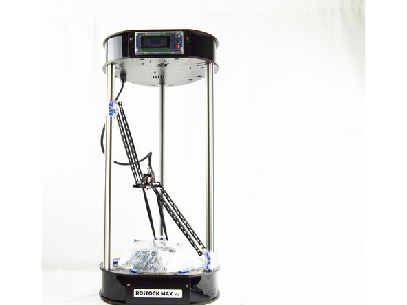 The arms have been inverted to prevent the hot end nozzle from striking the glass print surface during shipping. To invert the arms from shipping position to printing position