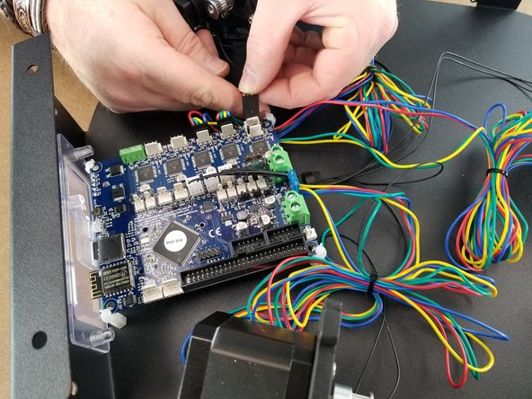 The Z motor will plug into the white plug closes to the corner of the Duet as shown in Pic 2.