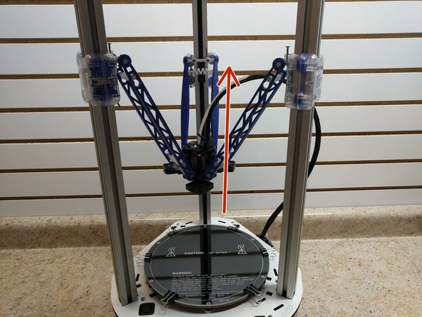 Slowly and carefully raise the carriages, one at a time until they are all three in printing position. Be sure to look at all three images before beginning.