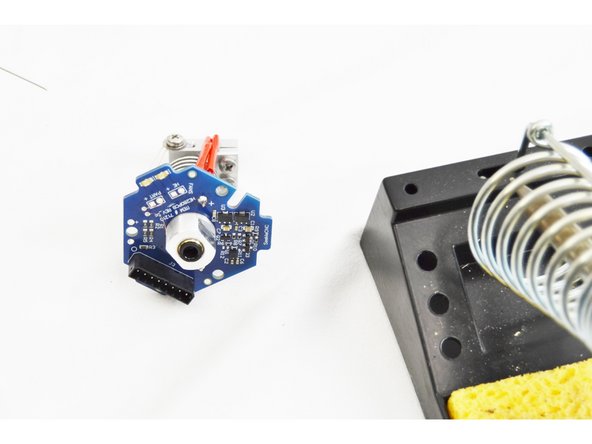 Confirm that the thermistor legs are inserted into the correct through hole location (marked with red arrows in the picture) on the HE280 Hotend PCB board.