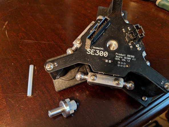 Remove the adapter from the hotend by unscrewing it and remove the old PTFE liner from the hotend. Figure 3.