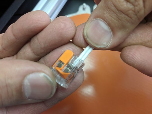 Machines before February 2018 and earlier: In the other side of the Wago connector, SIDE BY SIDE (AS SHOWN) install the 2 short 18awg white wires from the Z Tower wire pack .