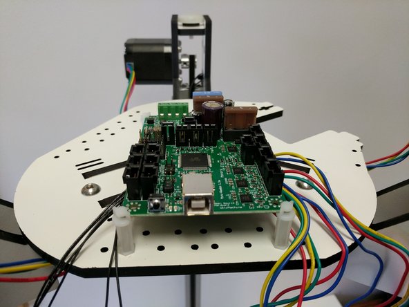 Install the Mini-RAMBo in the board supports. The board supports may need to be rotated so that they are at 45 degree angles to the board. They will catch on the 4 corners of the board.